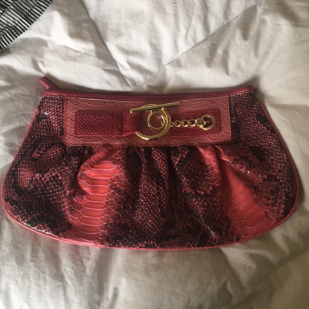 Express pink clutch with gold hardware